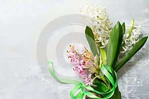 Bouquet of hyacinth flower on stone background or slate. Spring flowers background.