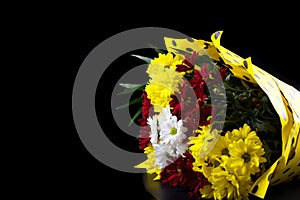 Bouquet isolated on black. Yellow chrysanthemums with copy space