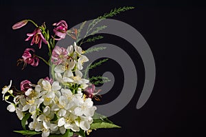 Bouquet of jasmine flowers on a black background, card with copy space