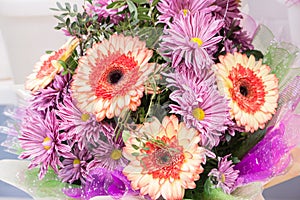 bouquet of large fresh orange gerbera chamomile and pink chrysanthemums
