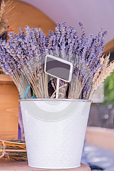 Bouquet of lavender in metal white vase background copy space. Rustic home decor, provence style