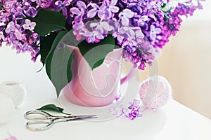 Bouquet of lilac, yarn, crochet hooks