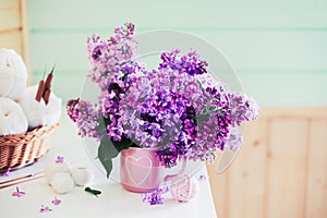 Bouquet of lilac, yarn, crochet hooks