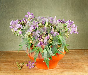 Bouquet of meadow flowers on a wooden table