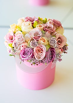 Bouquet of multicolored flowers roses in luxury gift box