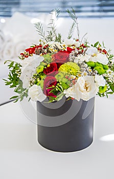 Bouquet of multicolored flowers roses in luxury gift box