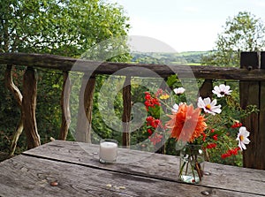 Bouquet of orange and white flowers on a balcony, England