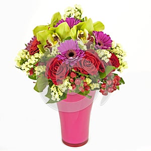 Bouquet of orchids, roses and gerberas in vase isolated on white photo