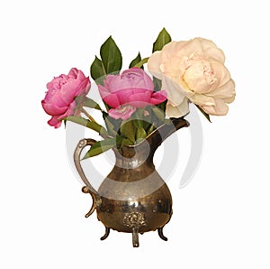 Bouquet of peonies in antique metal vase isolated on white background