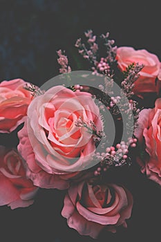 Bouquet of pink coral roses in dark, home decor for Wedding floral arrangement, grungy haze style