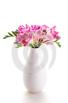 Bouquet of pink flowers in a white vase