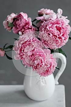Bouquet of pink peonies in a jug