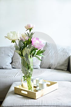 Bouquet of pink peonies in living room