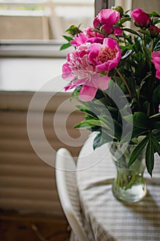 bouquet of pink peonies in a vase on the table