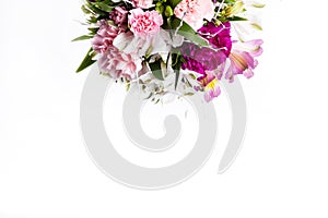 Bouquet from pink and purple gillyflowers on white background