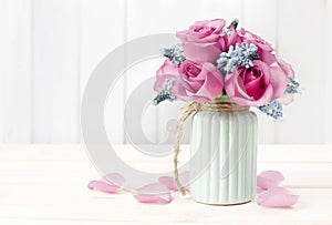 Bouquet of pink roses and blue muscari flower Grape Hyacinth