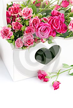 Bouquet pink roses in wooden basket