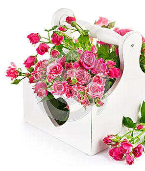 Bouquet pink roses in wooden basket