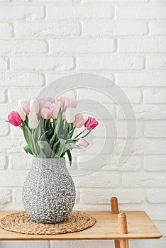 Bouquet of pink and white tulips in vase