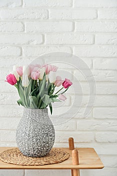 Bouquet of pink and white tulips in vase