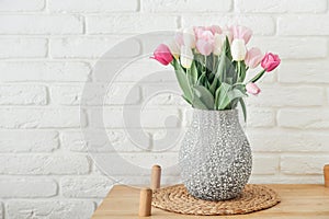 Bouquet of pink and white tulips in vase