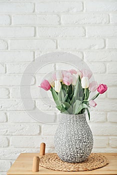 Bouquet of pink and white tulips in vase