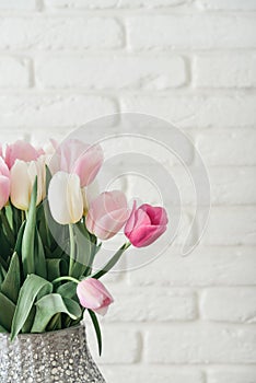 Bouquet of pink and white tulips in vase