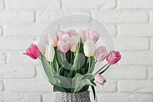 Bouquet of pink and white tulips in vase