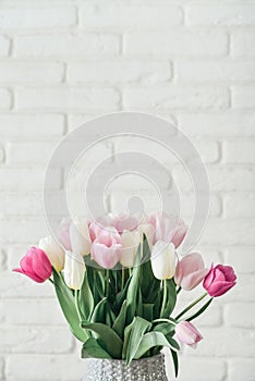 Bouquet of pink and white tulips in vase