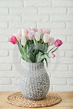 Bouquet of pink and white tulips in vase