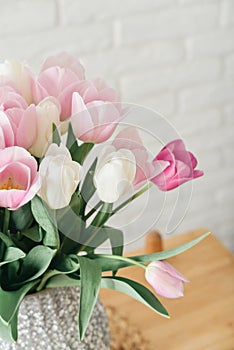 Bouquet of pink and white tulips in vase