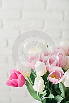 Bouquet of pink and white tulips in vase