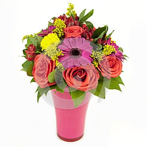 Bouquet of pink and yellow flowers in vase isolated on white photo