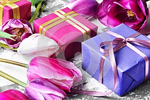 Bouquet of purple tulips and gift box