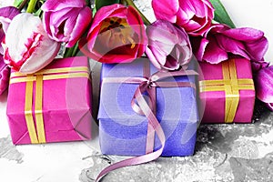 Bouquet of purple tulips and gift box