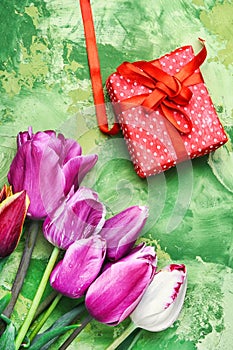 Bouquet of purple tulips and gift box