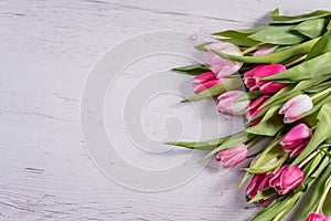 A bouquet of red and pink spring tulips on a colorful