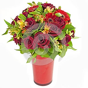 Bouquet of red roses and gerberas in vase isolated on white photo