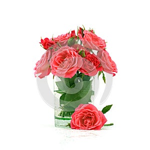 Bouquet of red roses in transparent glass vase