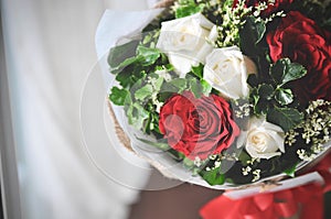 Bouquet of red and white roses background. Wedding natural flowers. Valentines day or 8 march floral gift.