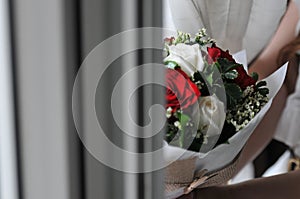 Bouquet of red and white roses background. Wedding natural flowers. Valentines day or 8 march floral gift.