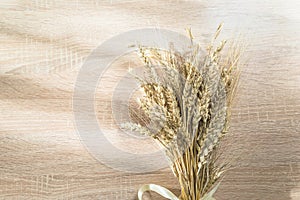 Bouquet of ripe wheat\'s ears on wooden background