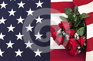 Bouquet of roses on American flag