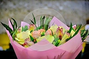 Bouquet of roses in the concert hall. Bouquet of flowers to congratulate the singers. Beautiful flowers for the singer on stage
