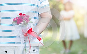 Bouquet Roses in hand man for little bride