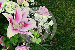 Bouquet of roses, lilies and orchids.