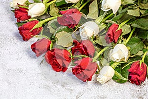 bouquet of roses, red and white. On a gray background. Congratulations to March 8 with Denm Birthday, Anniversary. ... photo