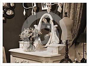 Bouquet of roses on a table with a mirror. Foto stylized antique photos, sepia.