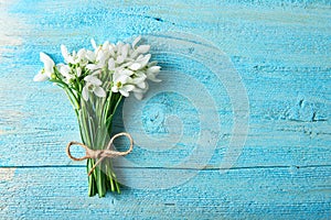 Bouquet of snowdrops on a blue background. gift for March 8, mother`s day