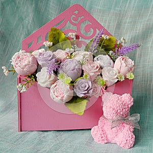 Bouquet of soap flowers and pink rose bear